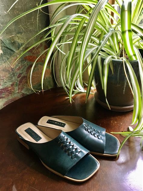 green leather slides.